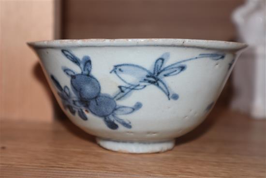 A pair of blanc de chine shi shi and blue and white bowl height 9cm